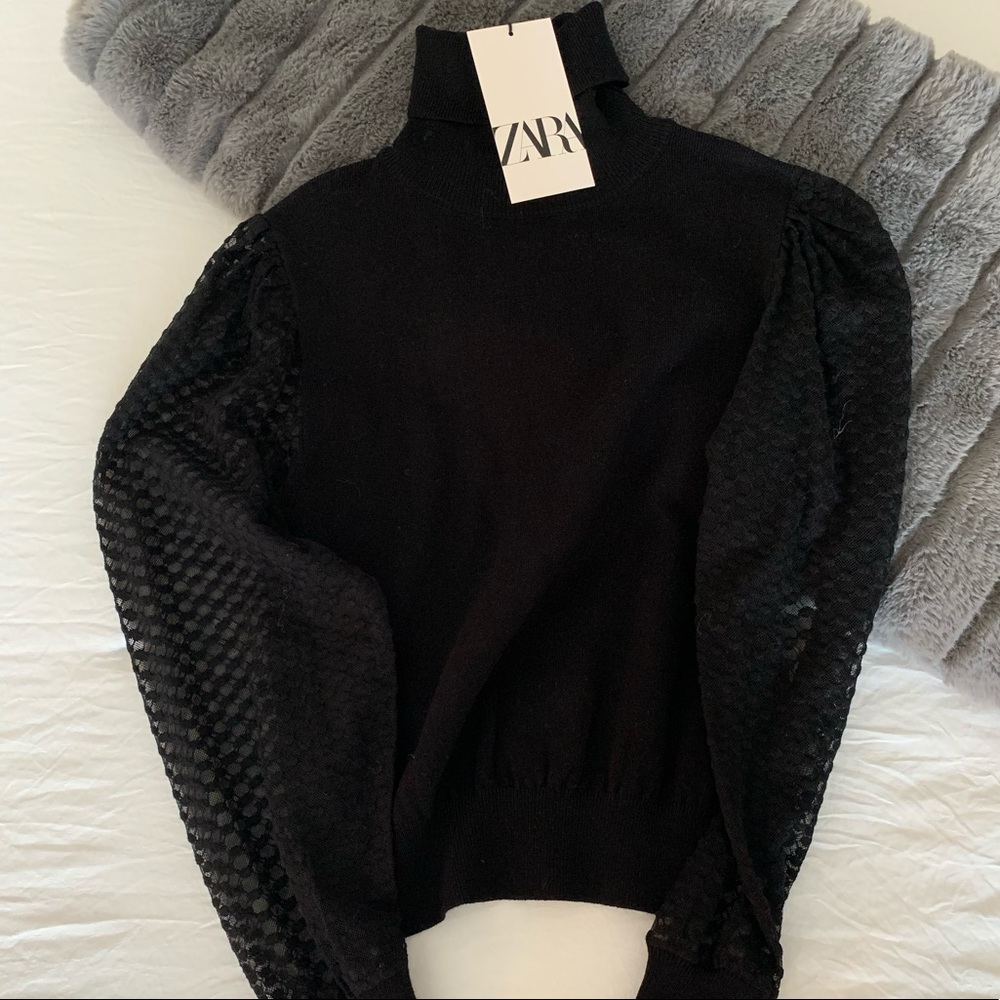 Black turtle neck.
